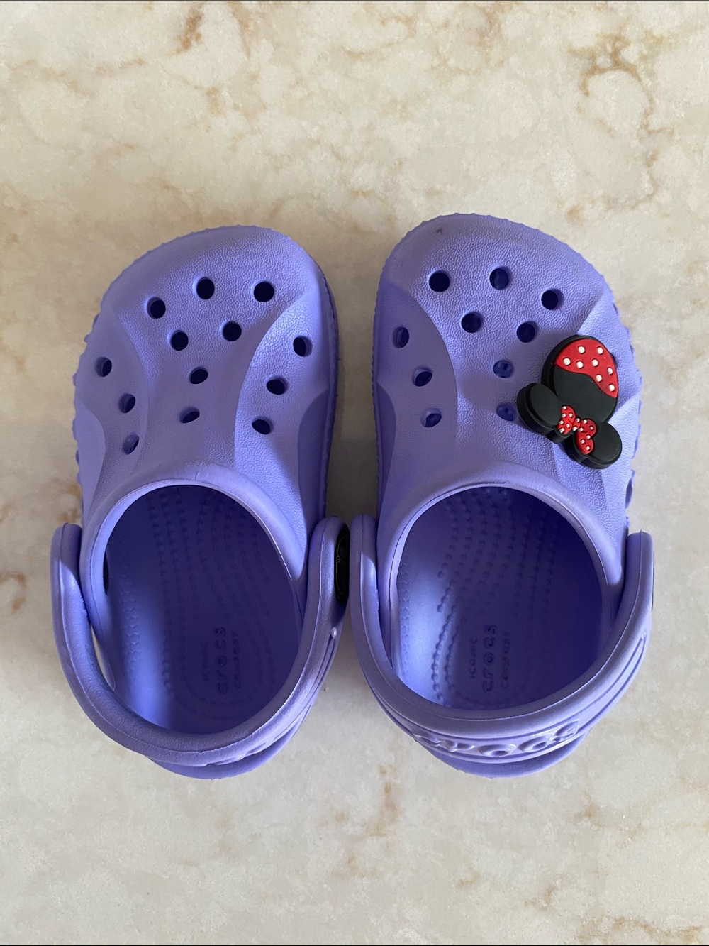 Purple Crocs/Shoes with Minnie Bow Charm size 4 baby like new.